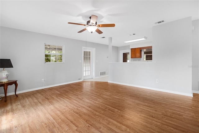 23761 SW Plaza Ct, Dunnellon, FL 34431 - unfurnished living room with ceiling fan and light hardwood / wood-style flooring