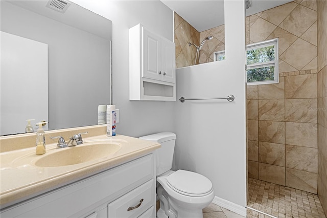 23761 SW Plaza Ct, Dunnellon, FL 34431 - bathroom with tile patterned floors, tiled shower, vanity, and toilet