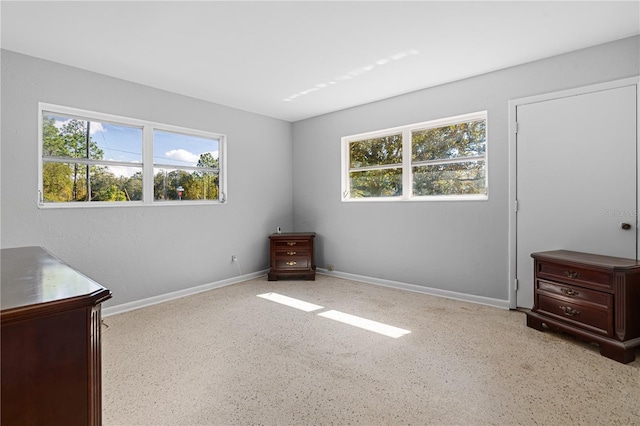 23761 SW Plaza Ct, Dunnellon, FL 34431 - unfurnished bedroom featuring multiple windows