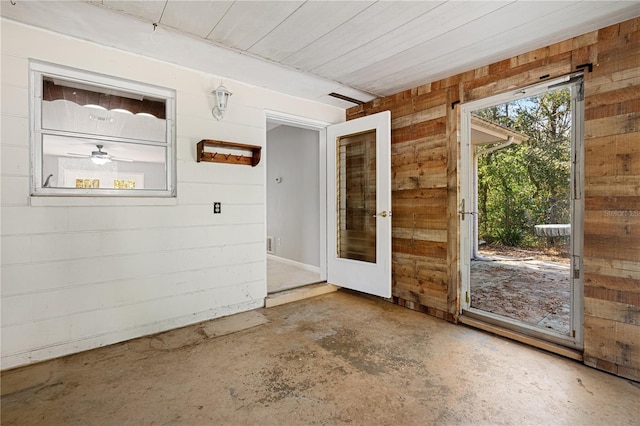 23761 SW Plaza Ct, Dunnellon, FL 34431 - doorway to outside with concrete floors and wood walls