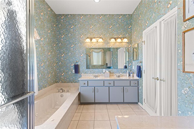 bathroom with vanity, tile patterned floors, and a bathing tub