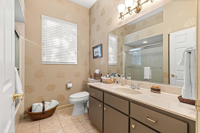 bathroom featuring vanity, toilet, and tile patterned flooring