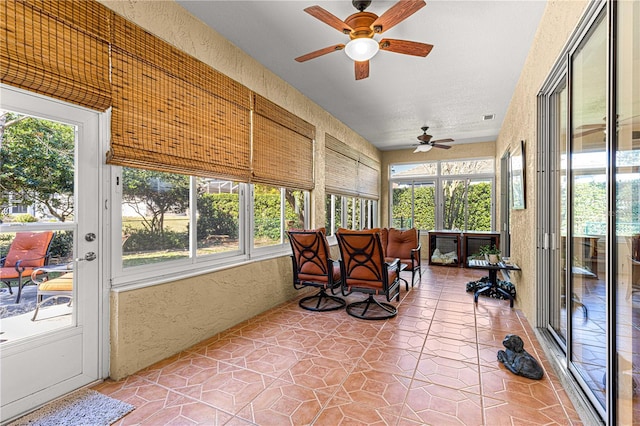 sunroom / solarium with ceiling fan