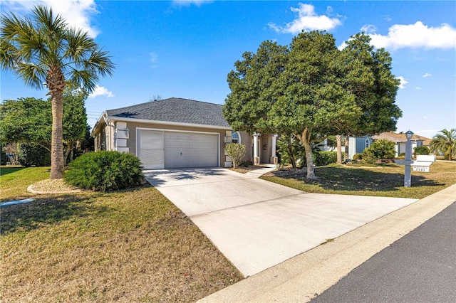 view of front of property with a garage and a front yard