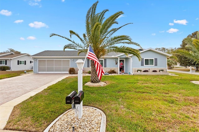 ranch-style house with a front lawn and a garage