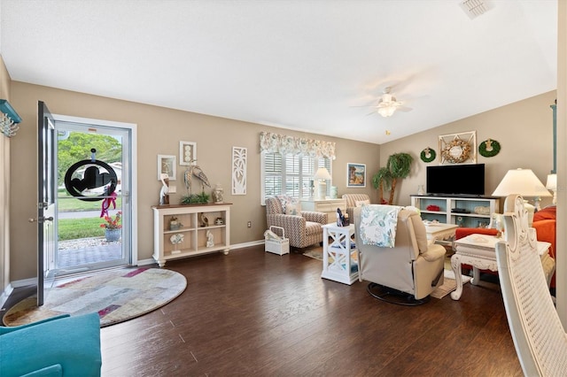 living room with ceiling fan, dark hardwood / wood-style floors, and lofted ceiling