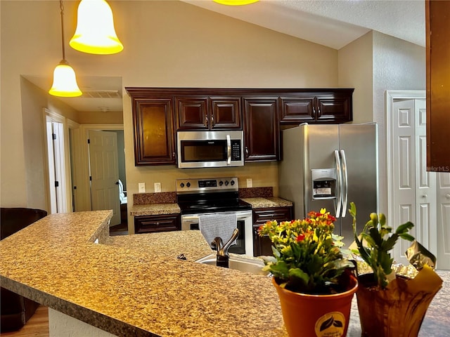 kitchen with dark brown cabinetry, decorative light fixtures, vaulted ceiling, and stainless steel appliances