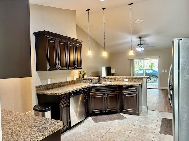 kitchen featuring sink, hanging light fixtures, dark brown cabinetry, kitchen peninsula, and stainless steel appliances