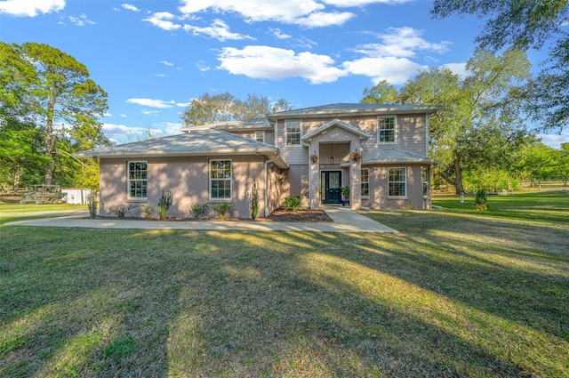 view of front of home featuring a front yard