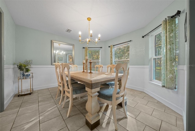 4161 NE 185th Ave, Williston, FL 32696 - dining area featuring light tile patterned floors and a chandelier