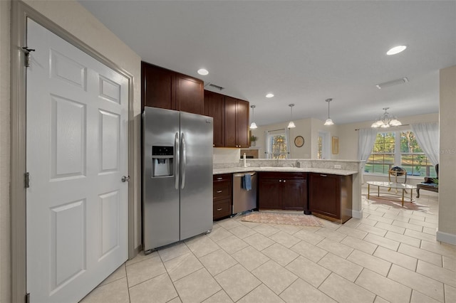 4161 NE 185th Ave, Williston, FL 32696 - kitchen featuring decorative light fixtures, a chandelier, light tile patterned floors, kitchen peninsula, and stainless steel appliances