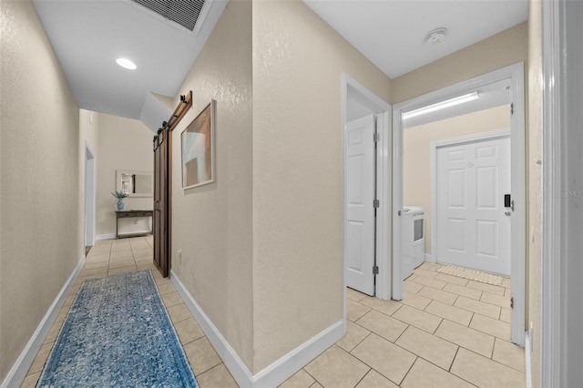4161 NE 185th Ave, Williston, FL 32696 - hall featuring a barn door and light tile patterned floors