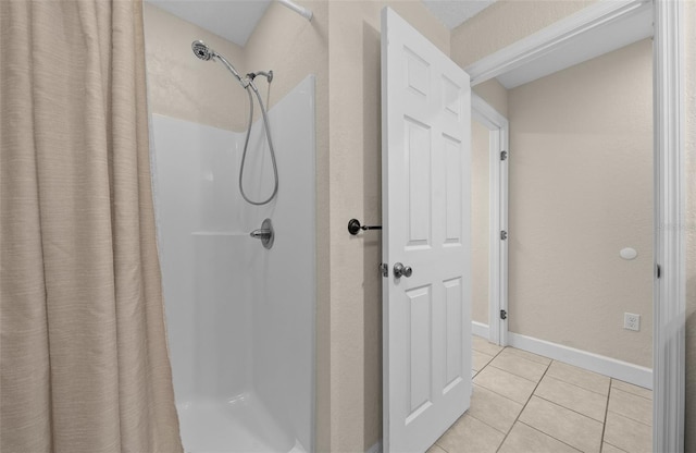 4161 NE 185th Ave, Williston, FL 32696 - bathroom featuring tile patterned floors and a shower with shower curtain