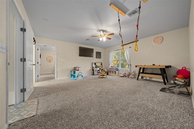 4161 NE 185th Ave, Williston, FL 32696 - playroom with ceiling fan, carpet, and a textured ceiling
