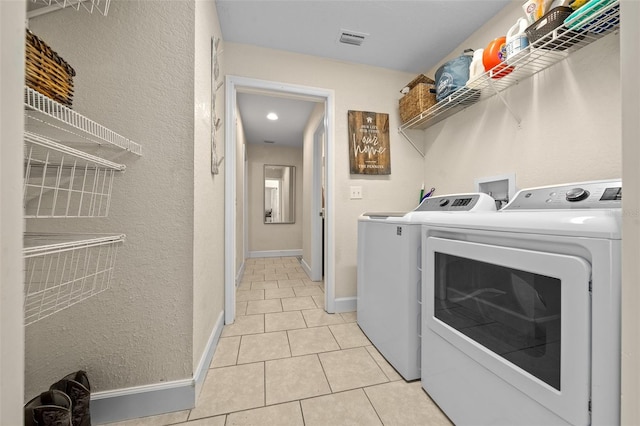 4161 NE 185th Ave, Williston, FL 32696 - clothes washing area with light tile patterned floors and independent washer and dryer