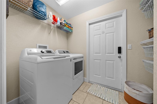 4161 NE 185th Ave, Williston, FL 32696 - washroom with separate washer and dryer and light tile patterned floors