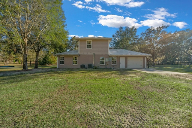 4161 NE 185th Ave, Williston, FL 32696 - view of front of property with central AC, a garage, and a front lawn
