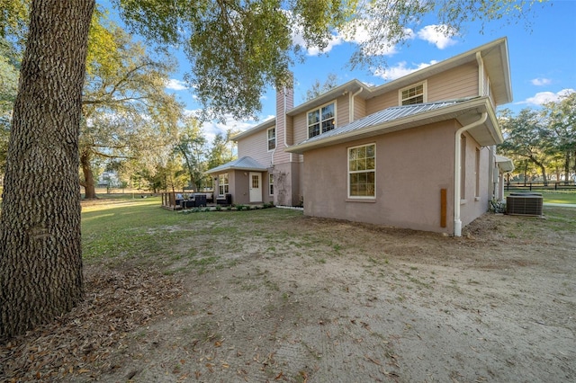 4161 NE 185th Ave, Williston, FL 32696 - rear view of house with central air condition unit