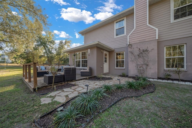 4161 NE 185th Ave, Williston, FL 32696 - back of property featuring a patio, an outdoor hangout area, and a lawn