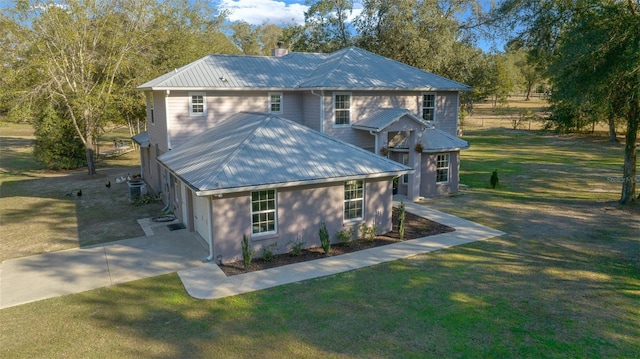 4161 NE 185th Ave, Williston, FL 32696 - view of front of house with a garage and a front lawn