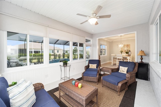 sunroom with a ceiling fan