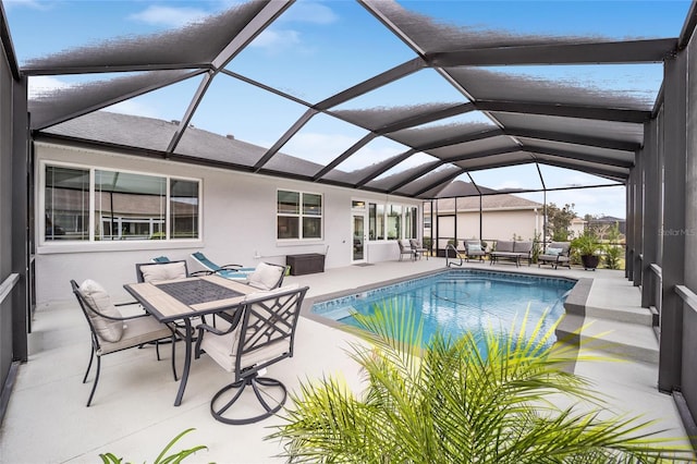 pool featuring a lanai and a patio area