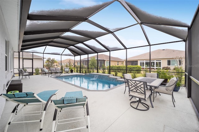 pool featuring a patio area, a lanai, and a residential view