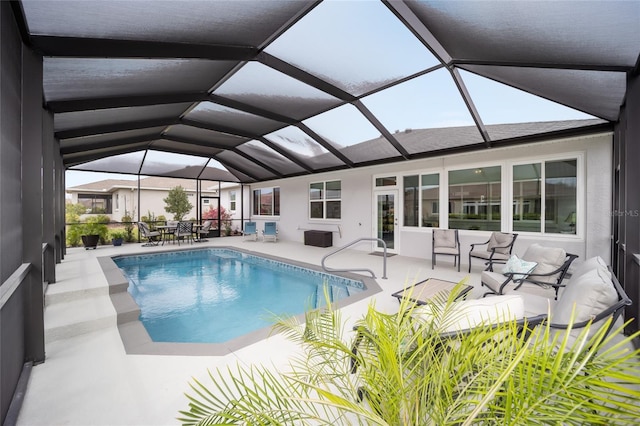 pool featuring a lanai and a patio area