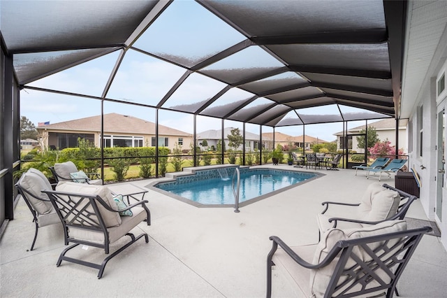 pool with a residential view, a lanai, and a patio area