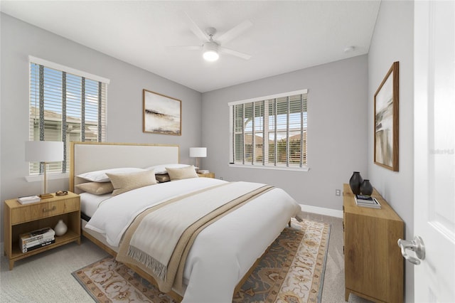 bedroom featuring ceiling fan, carpet floors, and baseboards