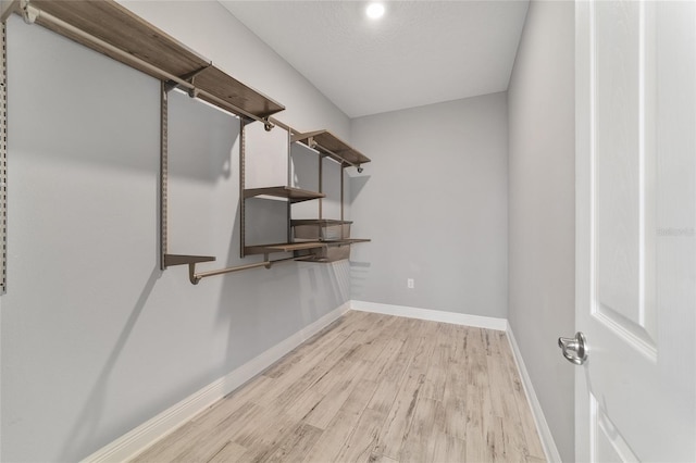 walk in closet featuring light wood-style floors