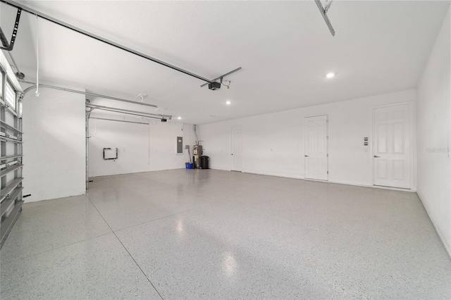 garage featuring a garage door opener and electric panel