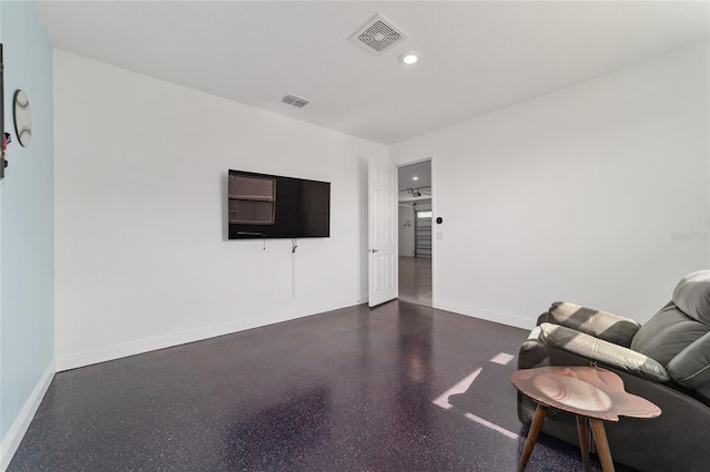 living area with recessed lighting, visible vents, and baseboards