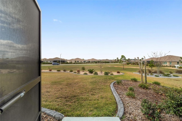 view of yard featuring a residential view