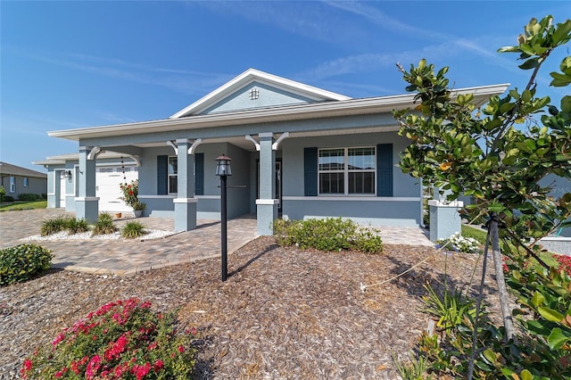 8107 SW 92nd Cir, Ocala, FL 34481 - view of front facade featuring a porch and stucco siding