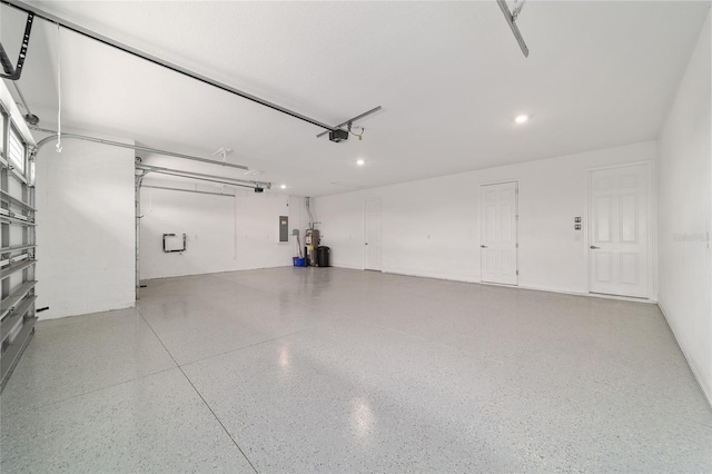 8107 SW 92nd Cir, Ocala, FL 34481 - garage featuring recessed lighting, a garage door opener, and electric panel