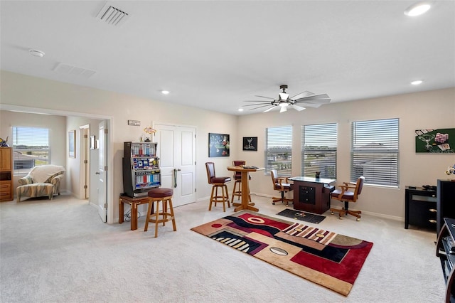 home office with a ceiling fan, recessed lighting, visible vents, and light carpet