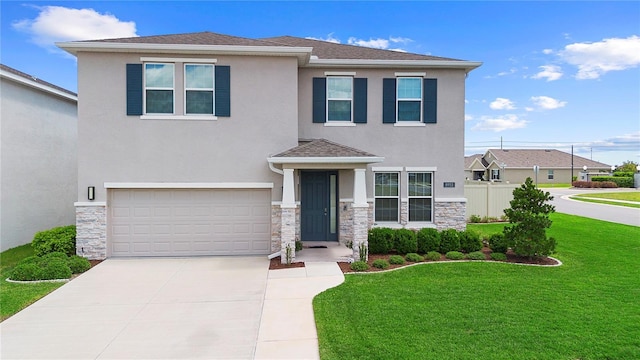 8953 SW 50th Ter, Ocala, FL 34476 - view of front of property featuring a front yard, concrete driveway, stucco siding, an attached garage, and fence