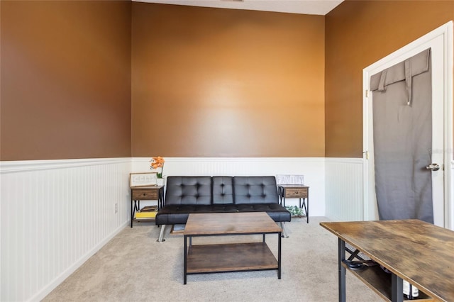 living area featuring light colored carpet