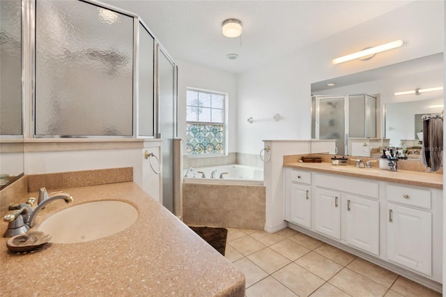 bathroom with vanity, tile patterned floors, and separate shower and tub