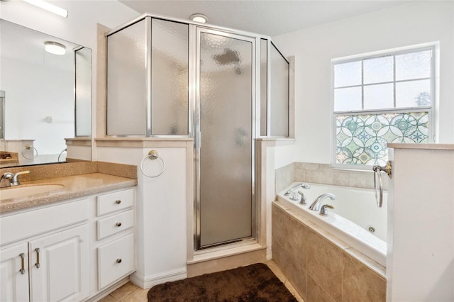 bathroom featuring vanity, tile patterned flooring, shower with separate bathtub, and a healthy amount of sunlight