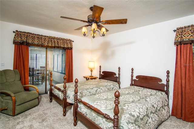 bedroom with carpet floors, access to outside, and ceiling fan