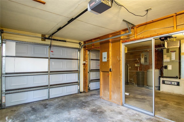 garage with heating unit, electric panel, and a garage door opener