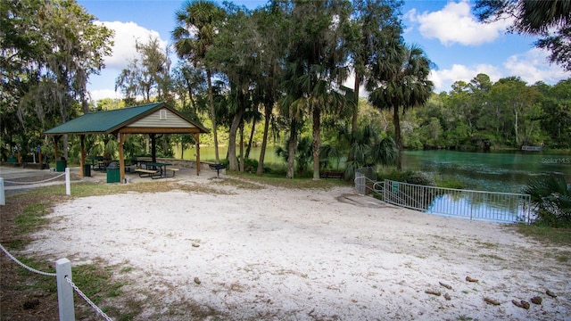 view of home's community featuring a water view and a gazebo