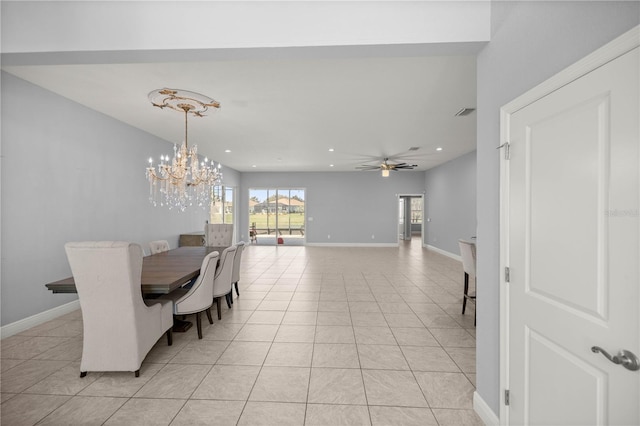 dining area with light tile patterned floors and ceiling fan with notable chandelier