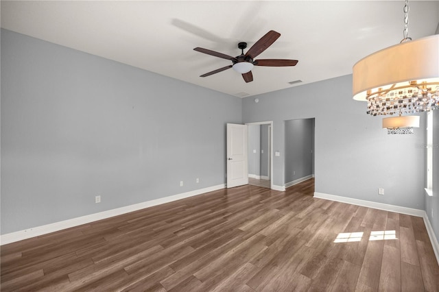 spare room featuring wood-type flooring and ceiling fan