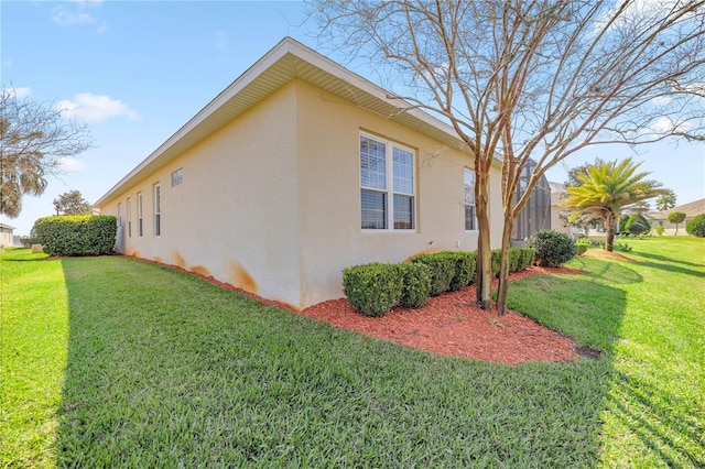 view of property exterior featuring a yard