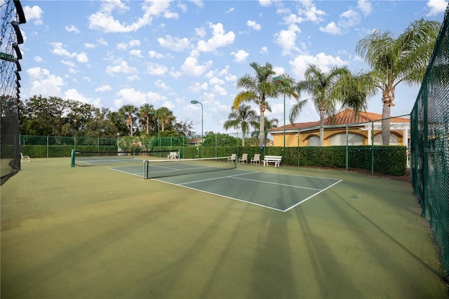 view of sport court featuring basketball hoop