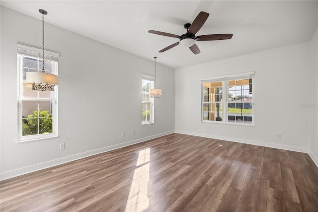 10138 Lake Miona Way, Oxford, FL 34484 - spare room with wood finished floors and a ceiling fan