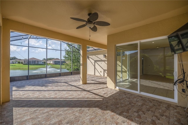 10138 Lake Miona Way, Oxford, FL 34484 - unfurnished sunroom with a ceiling fan, a water view, and a residential view